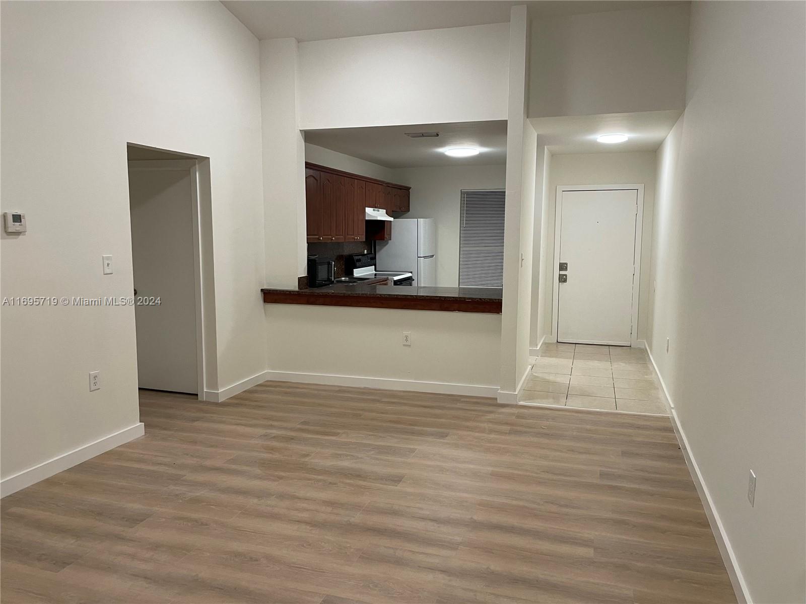 a view of a kitchen from the hallway