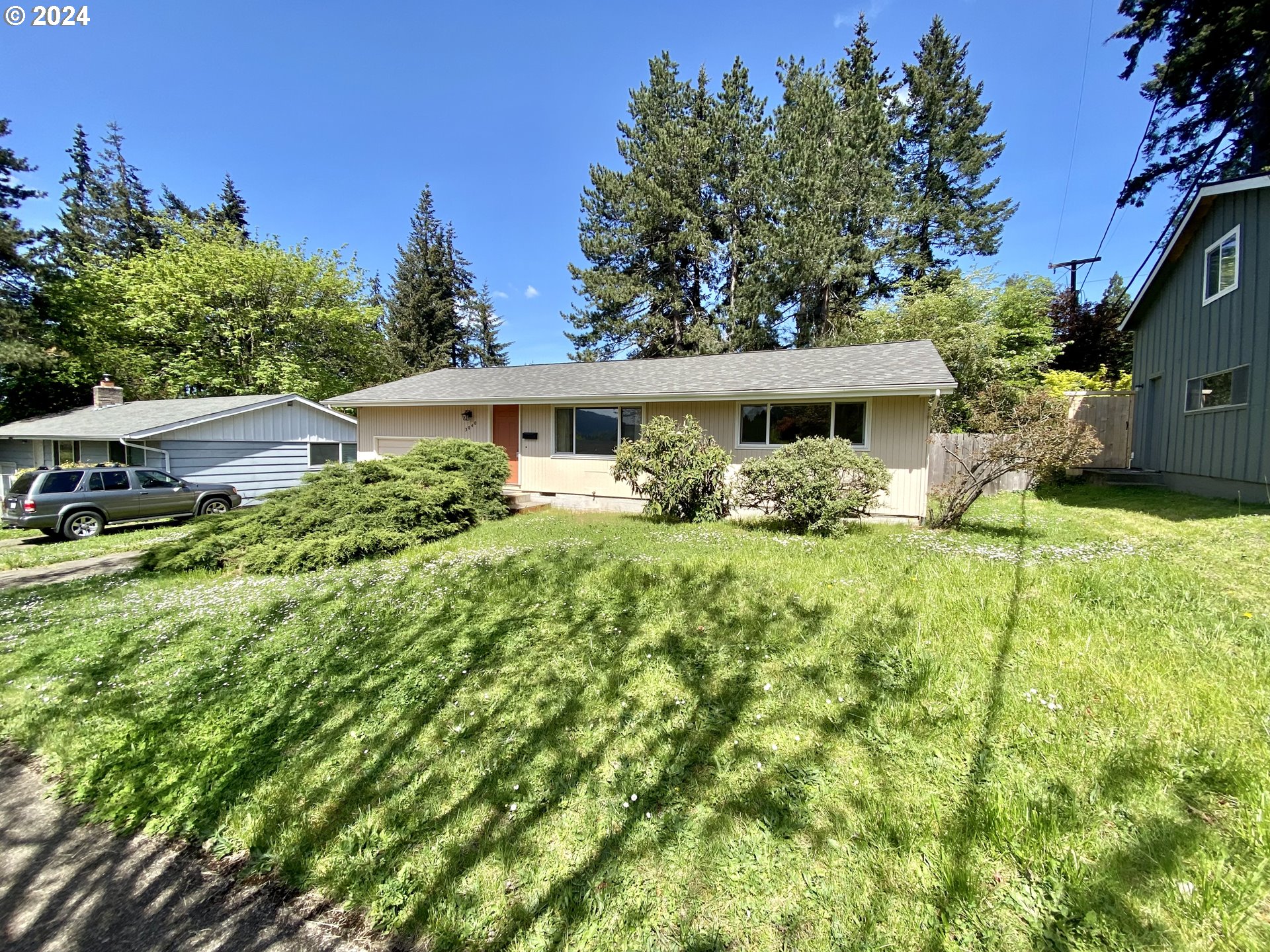 a front view of a house with garden