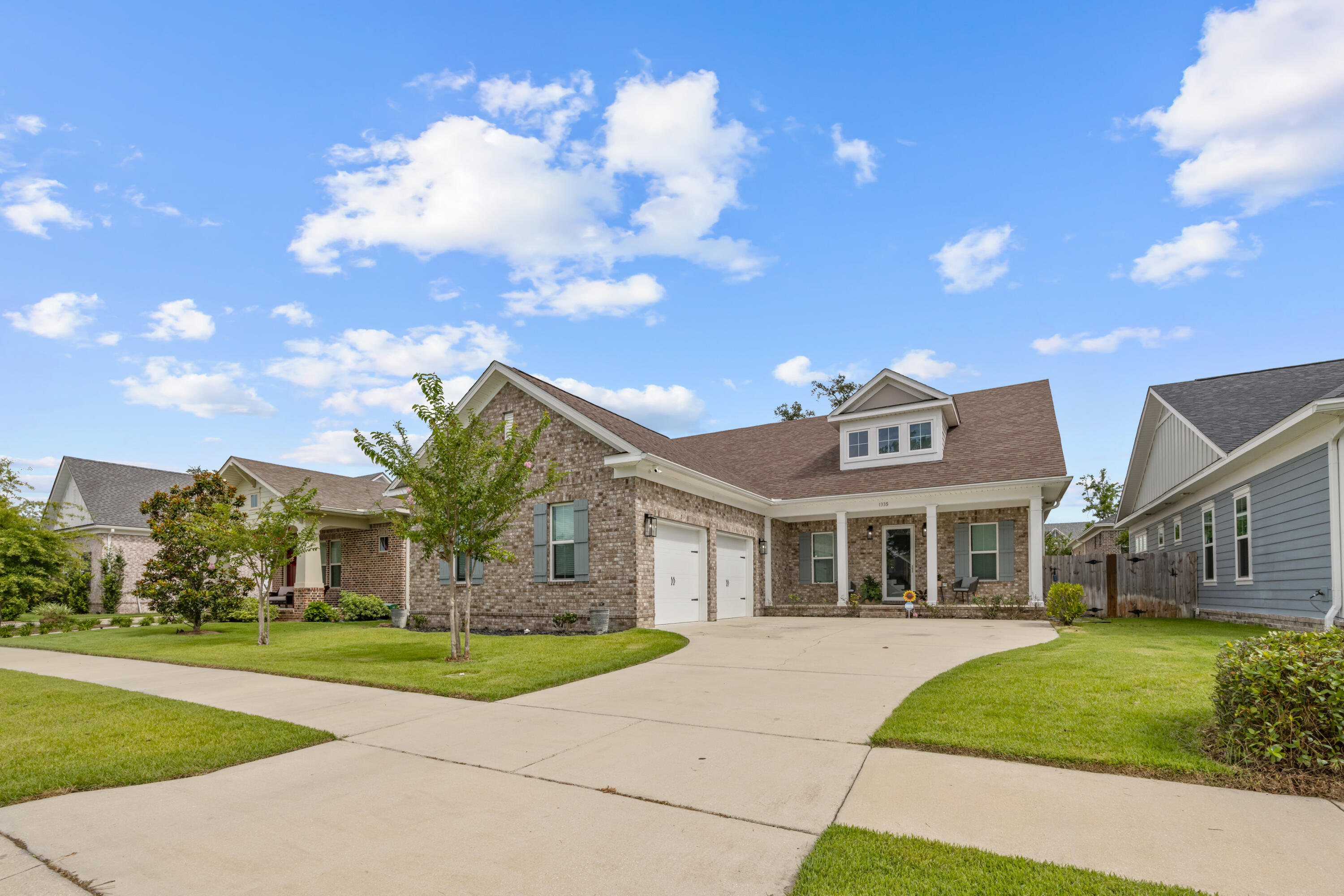 front view of a house with a yard