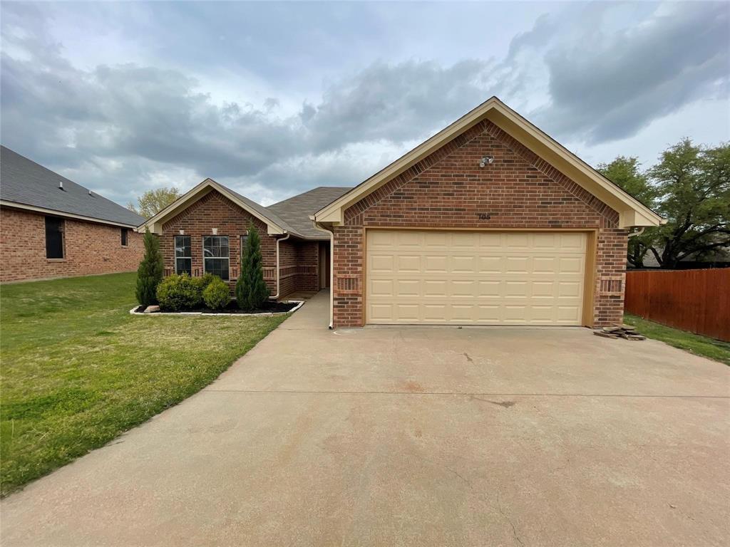 front view of house with a yard