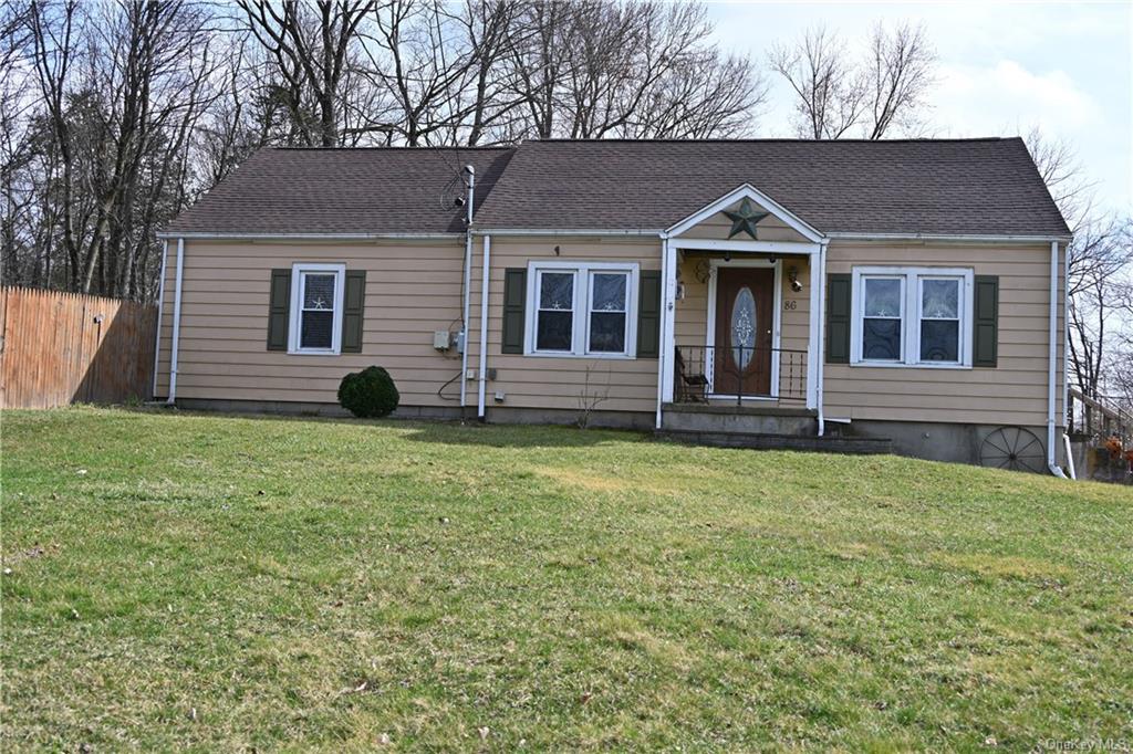 a view of a house with a yard