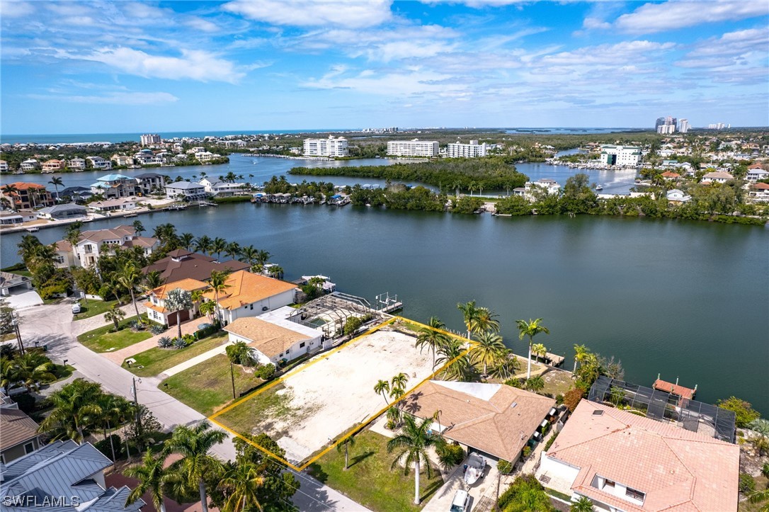 an aerial view of a house with a lake view