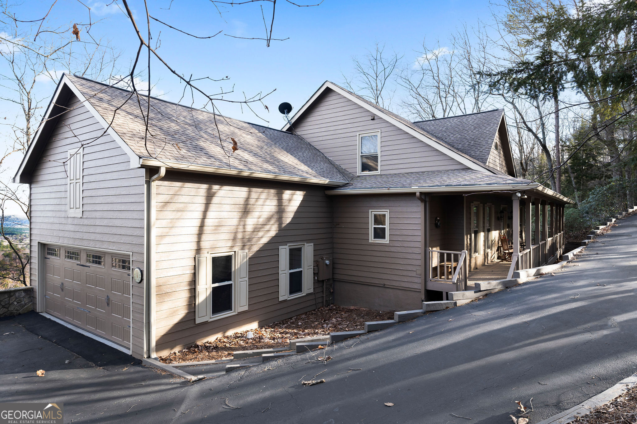 a front view of a house with a garage