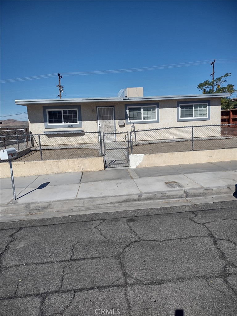 a front view of a house with street