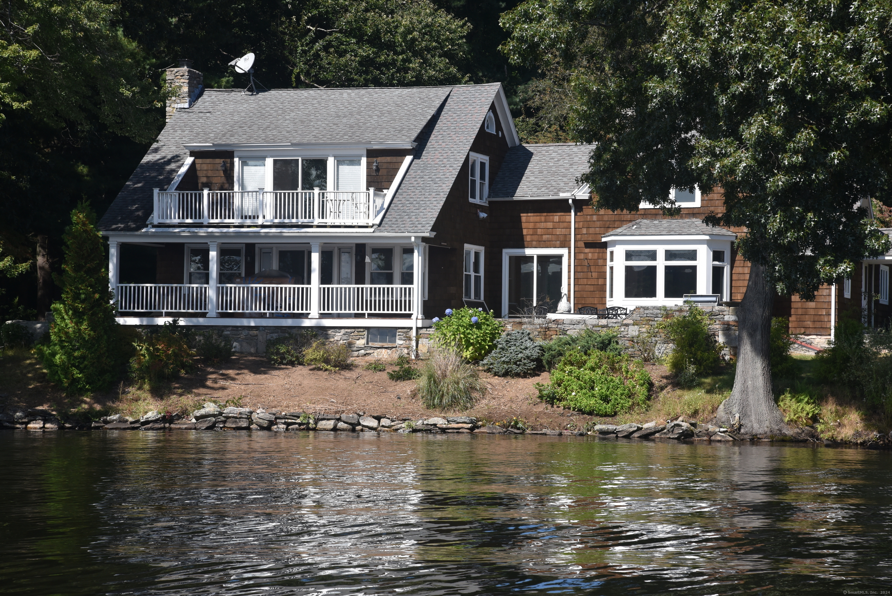 a front view of a house with a lake view