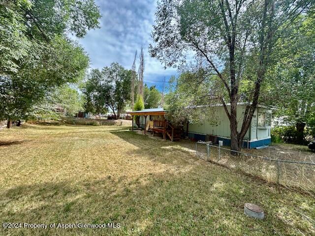 a view of backyard with outdoor space