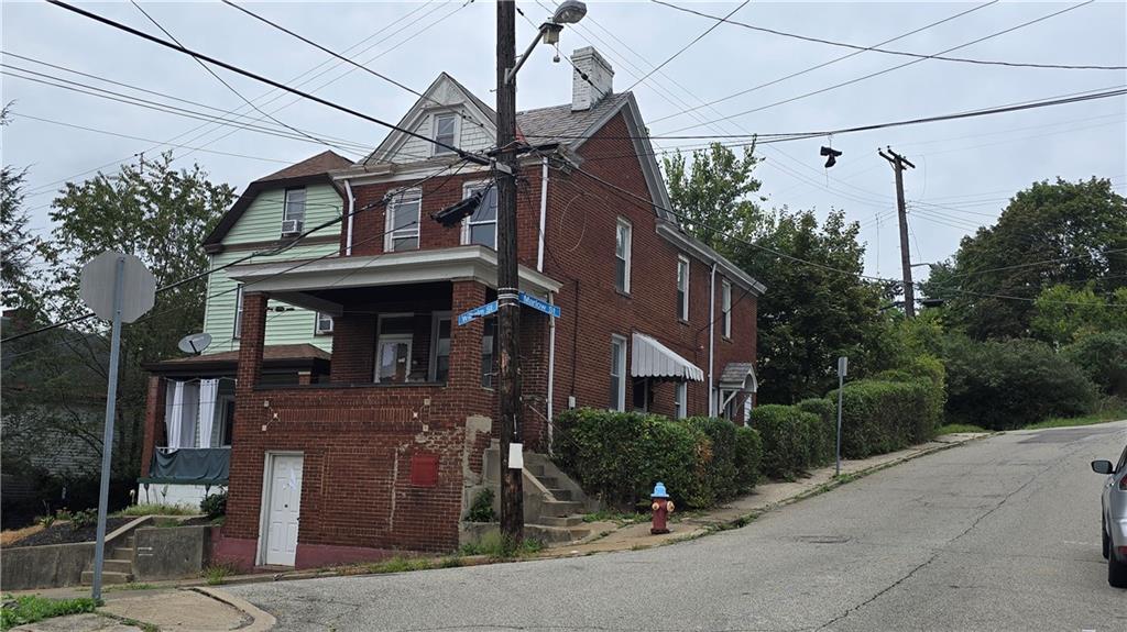 a view of a house with a street