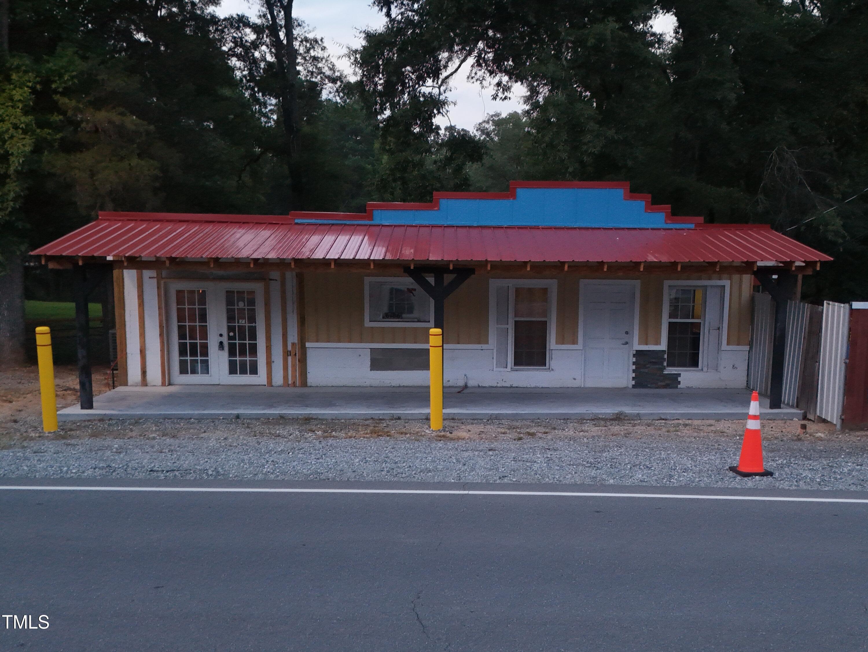 a front view of a house with street