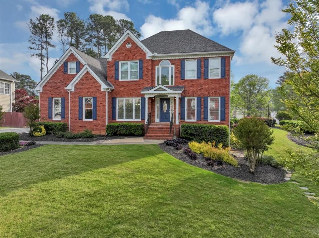 front view of a house with a yard