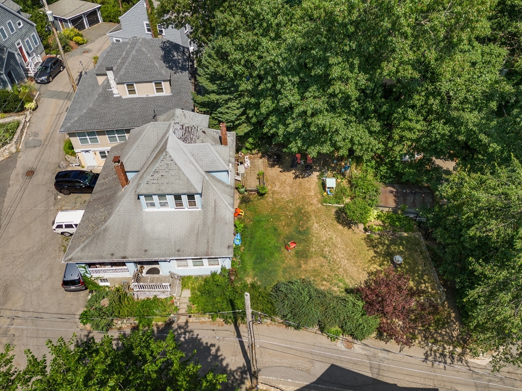 an aerial view of residential houses with outdoor space