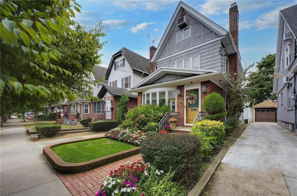 a front view of a house with garden