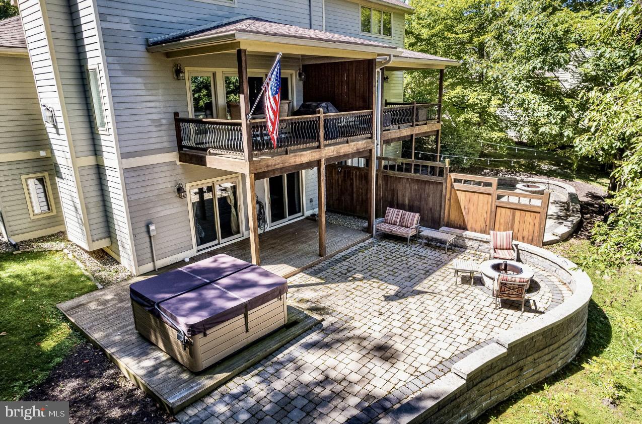 a view of a chairs and table in the backyard