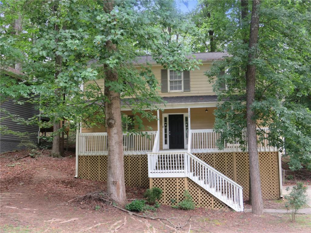 a front view of a house with a fence