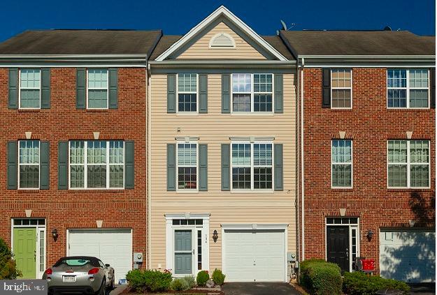 a front view of a building with a yard