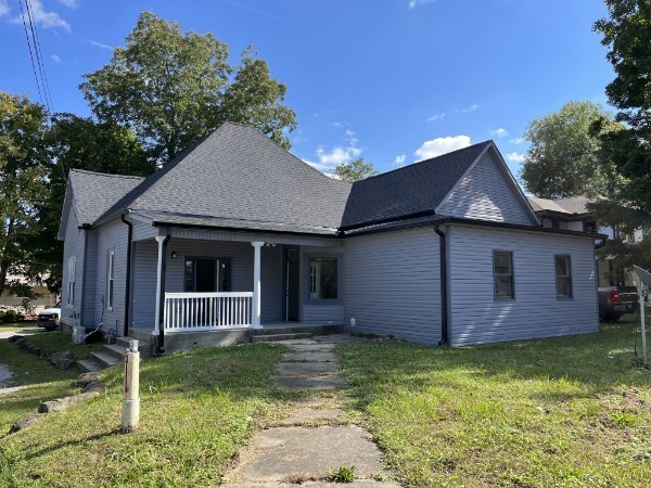 a front view of a house with garden