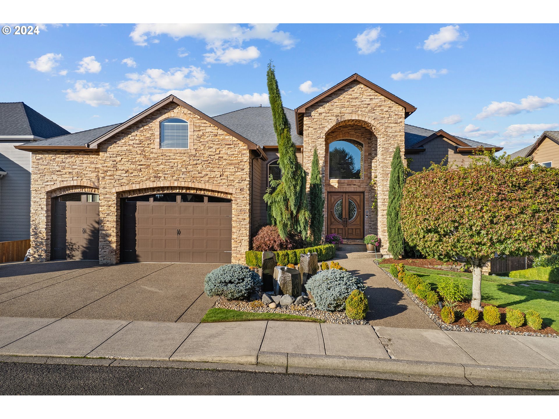 a front view of a house with a yard