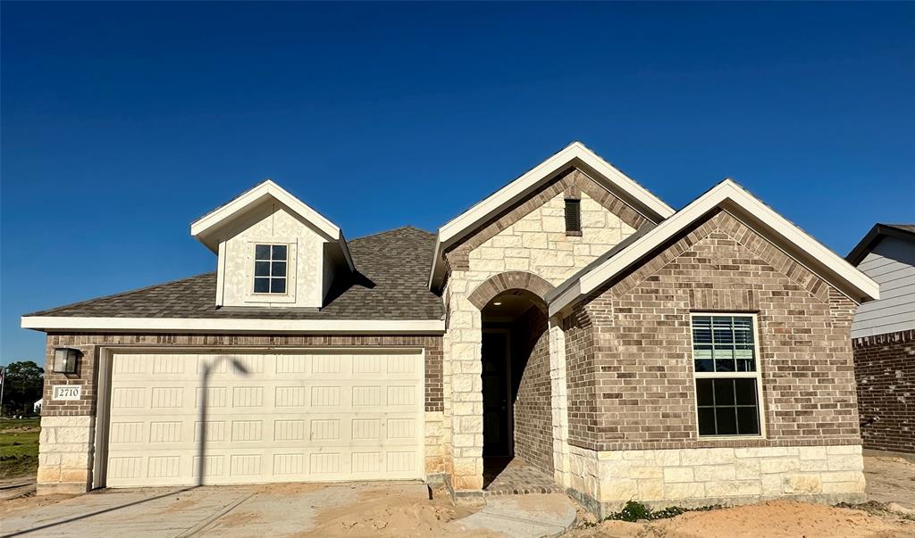 a view of a house with garage