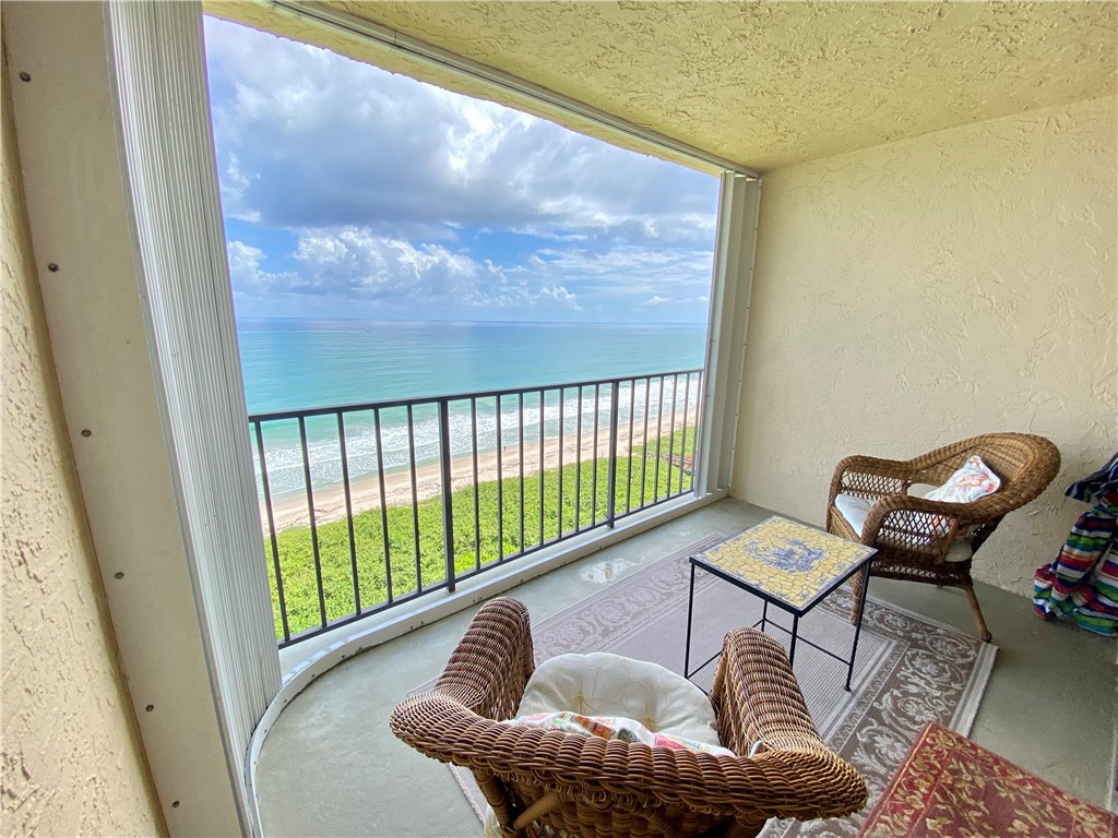 a view of balcony with furniture