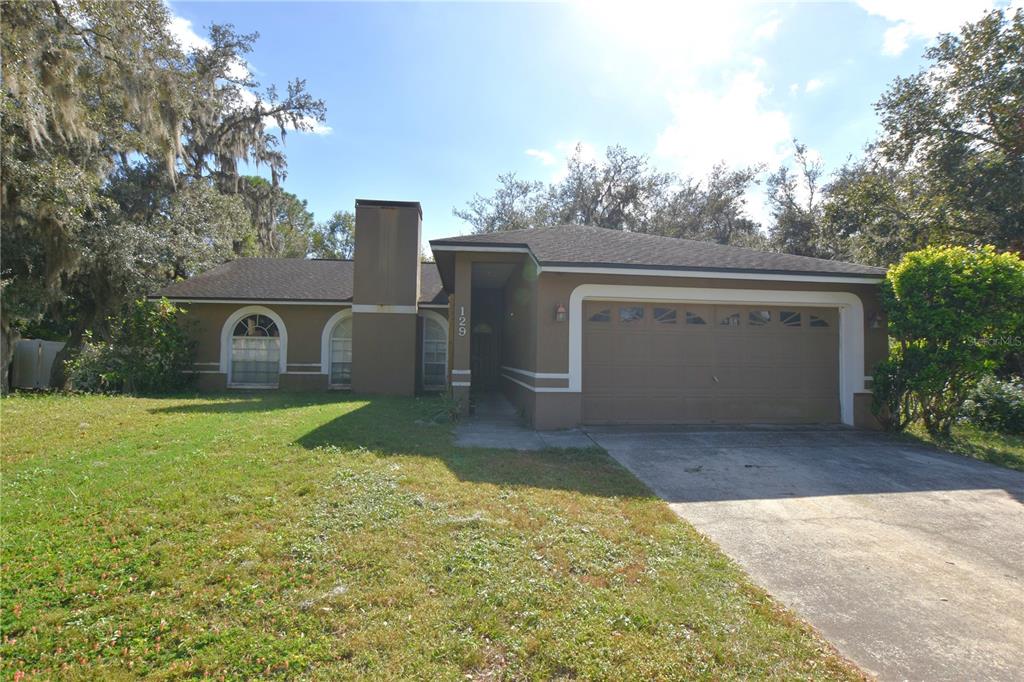 a view of a house with backyard