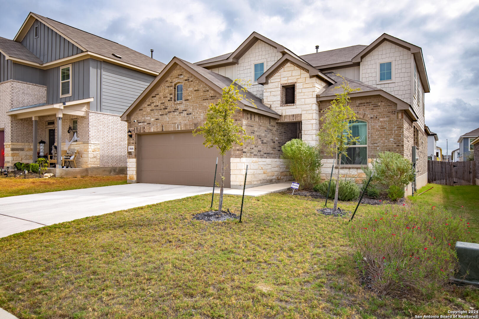 a front view of a house with garden