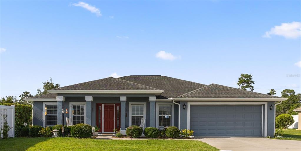 a front view of a house with garden