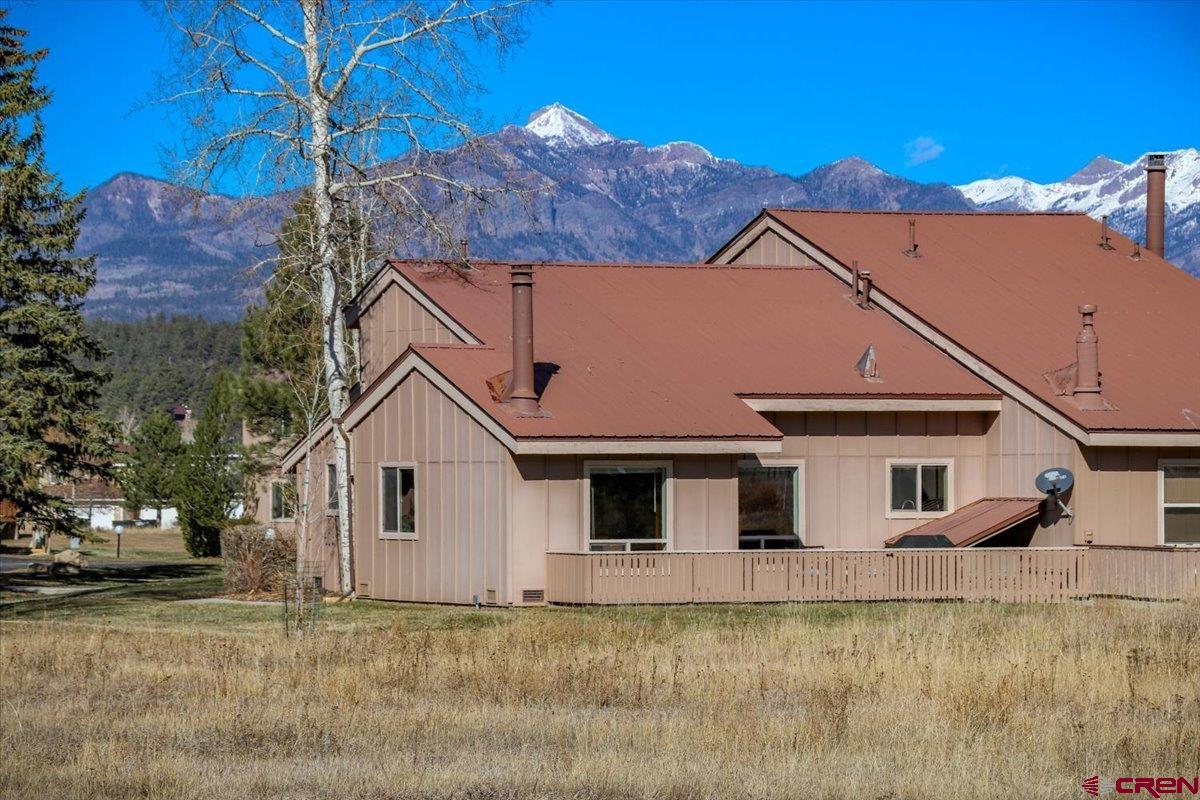 a view of a house with a yard