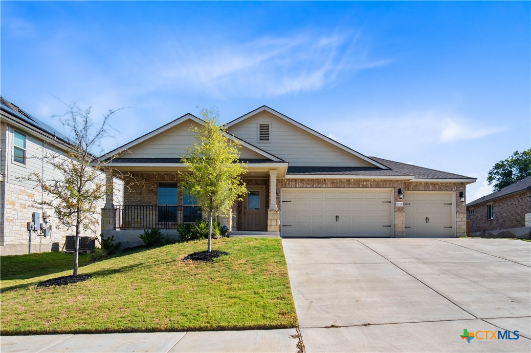 a front view of a house with a yard