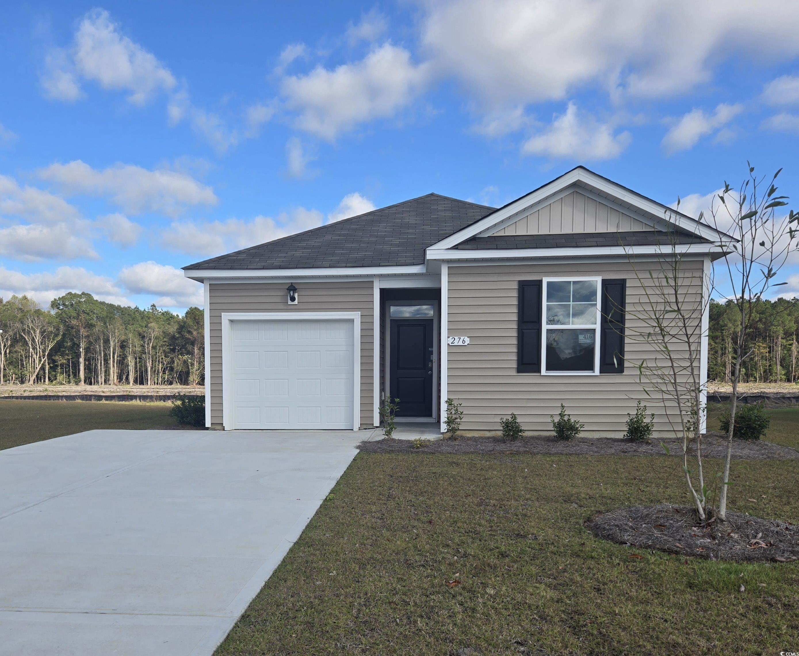 View of front of property with a front yard and a