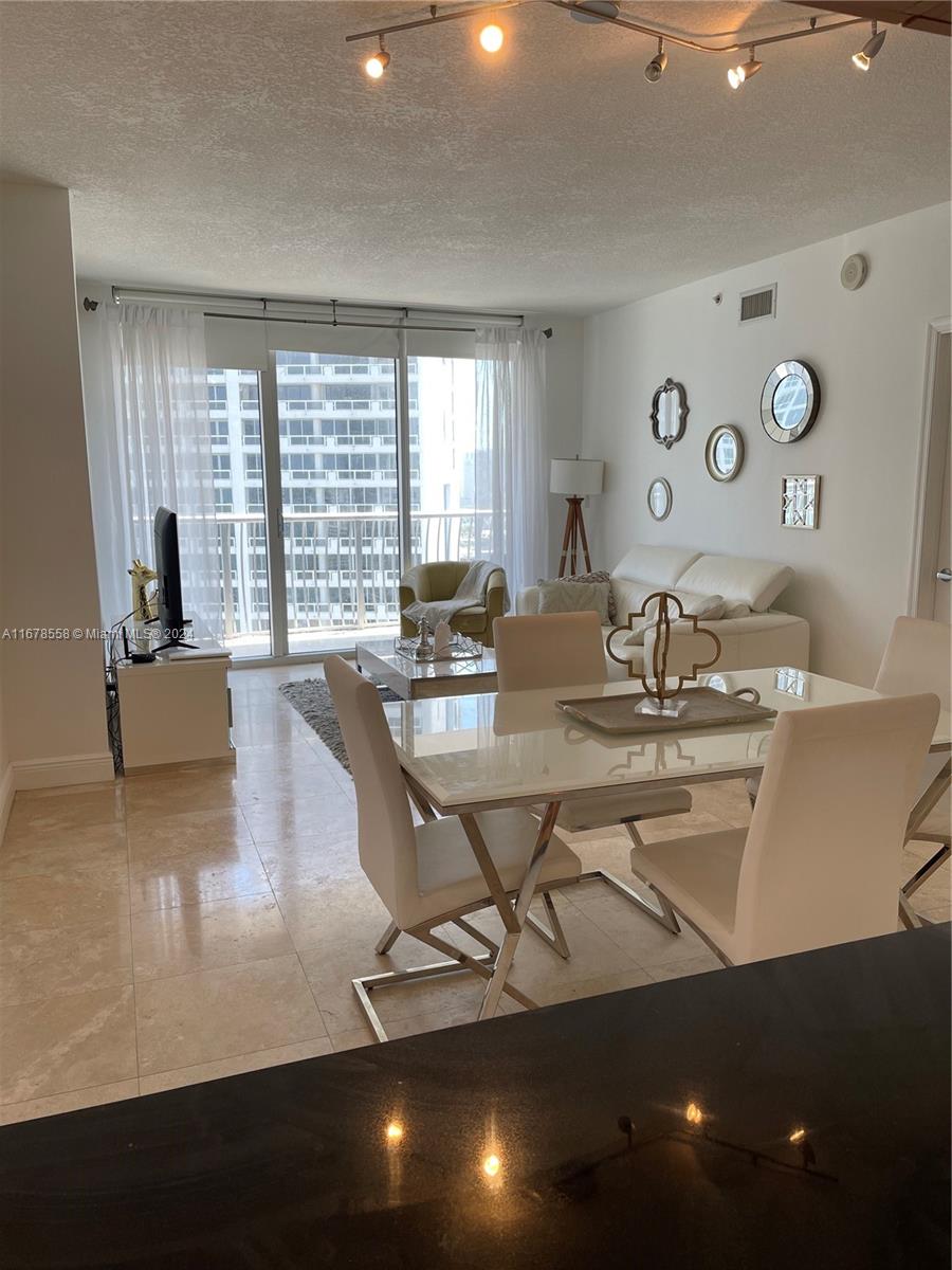 a view of a dining room with furniture