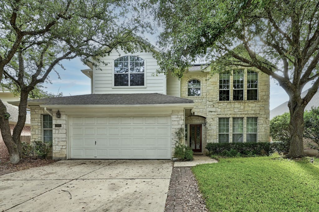 front view of a house with a yard