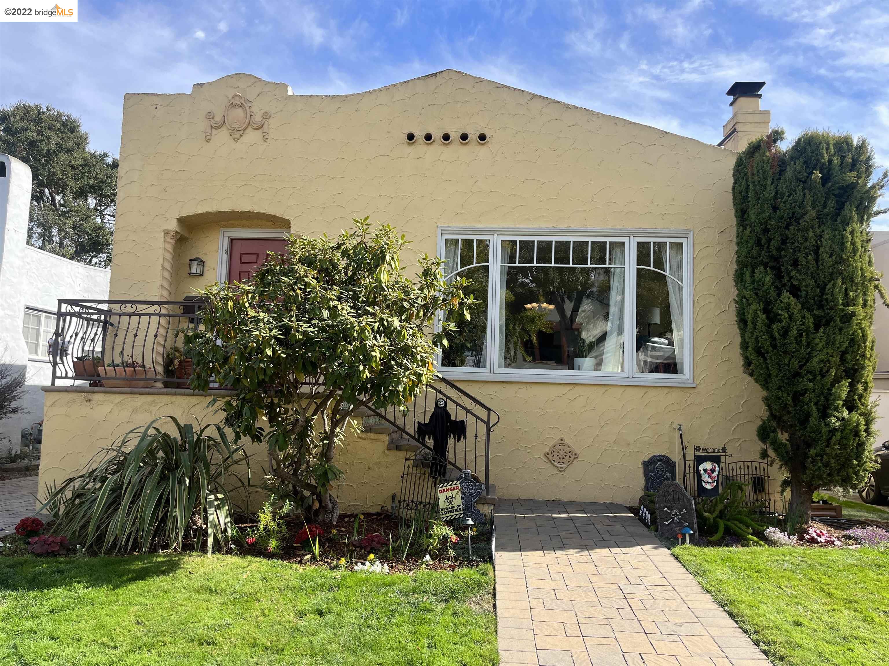 a front view of a house with garden