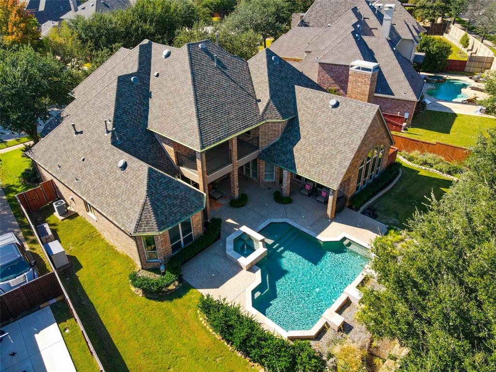 an aerial view of a house with swimming pool