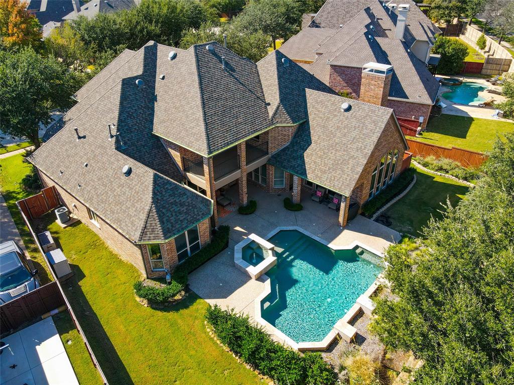 an aerial view of a house with swimming pool