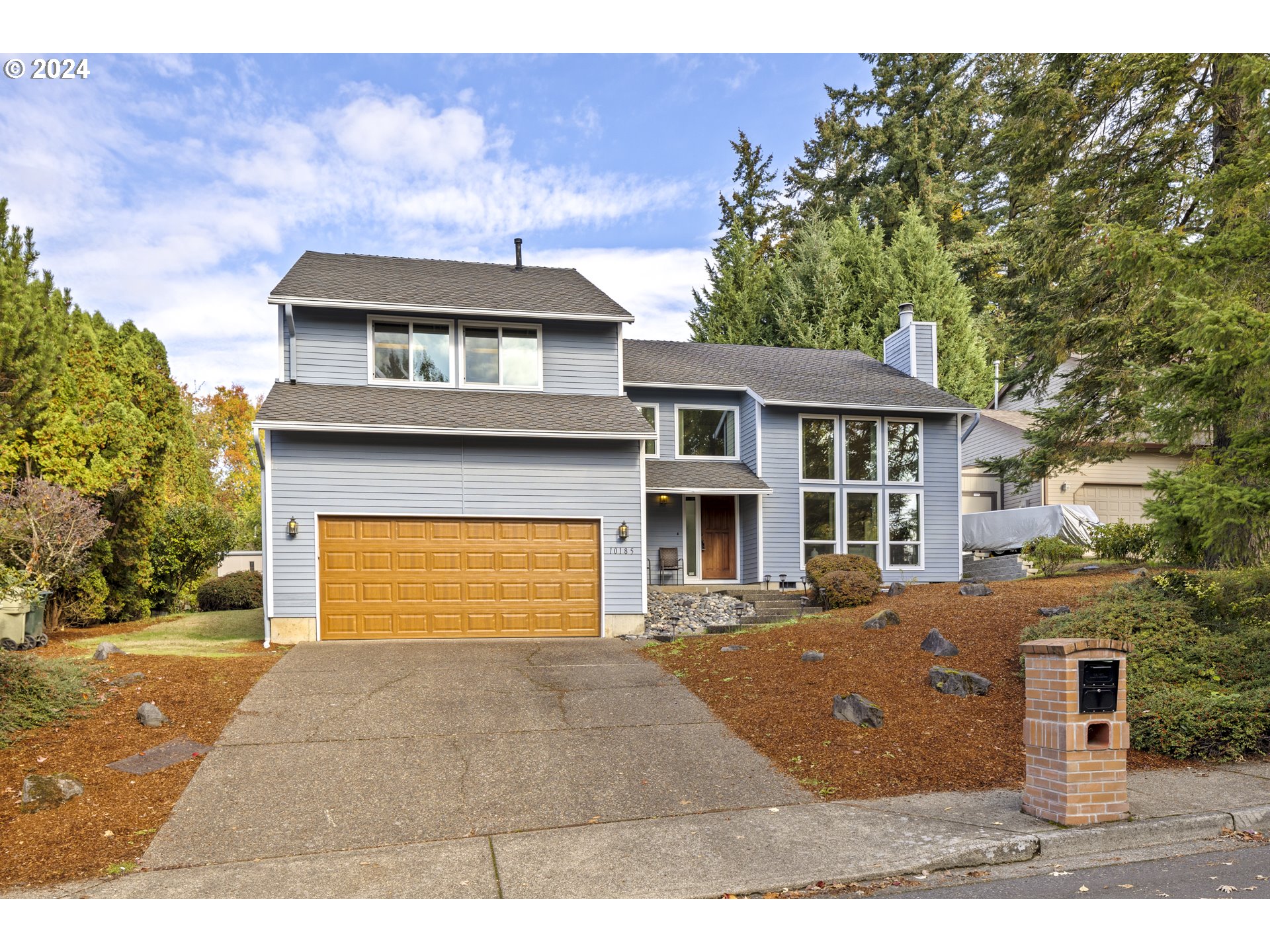 a front view of a house with a yard