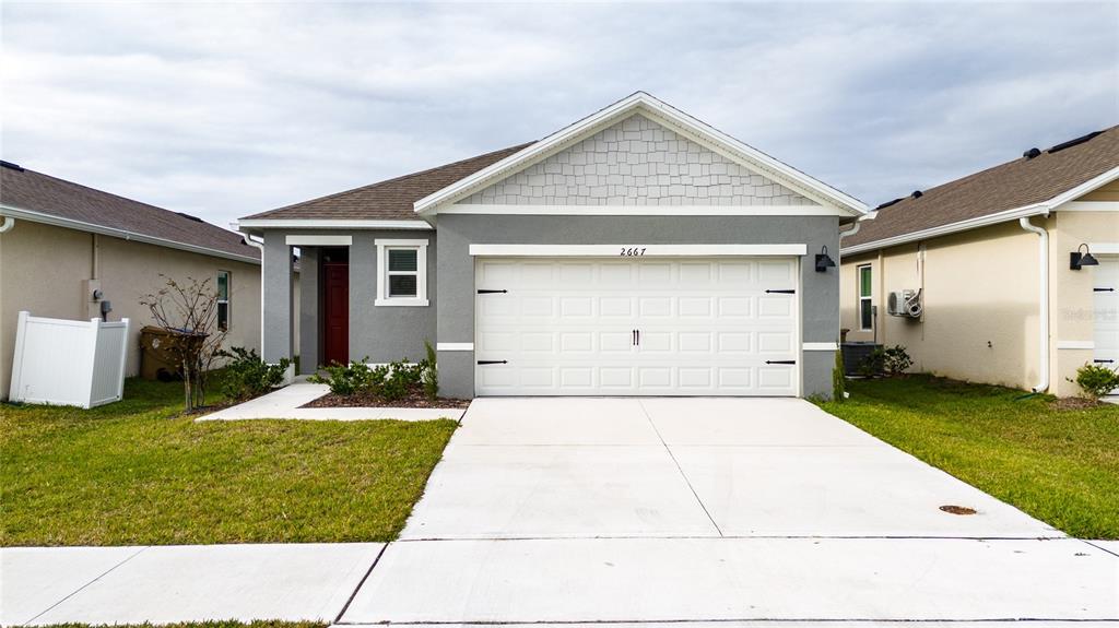 a backyard of a house with yard and garage