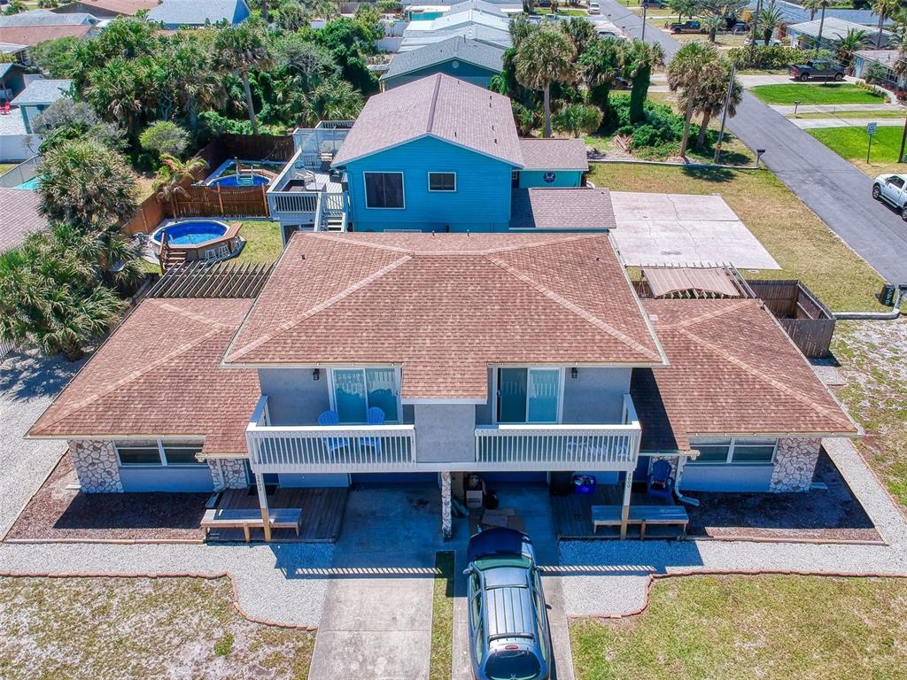 an aerial view of a house with swimming pool