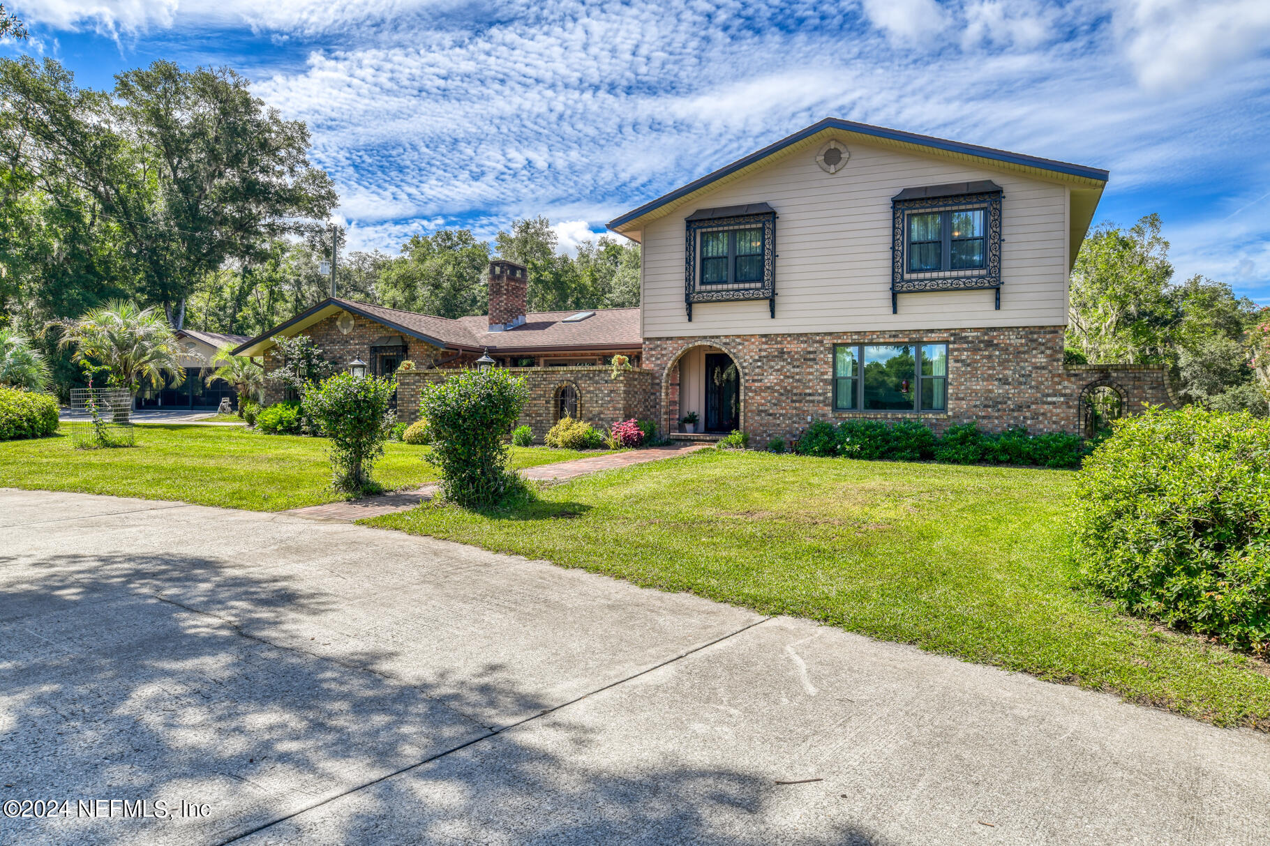 a house view with a garden space