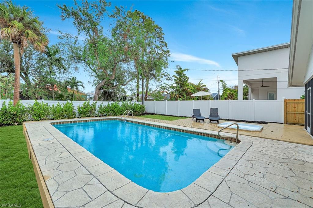 a view of swimming pool with seating space