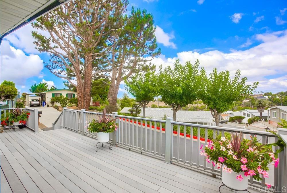 a view of a balcony with wooden floor