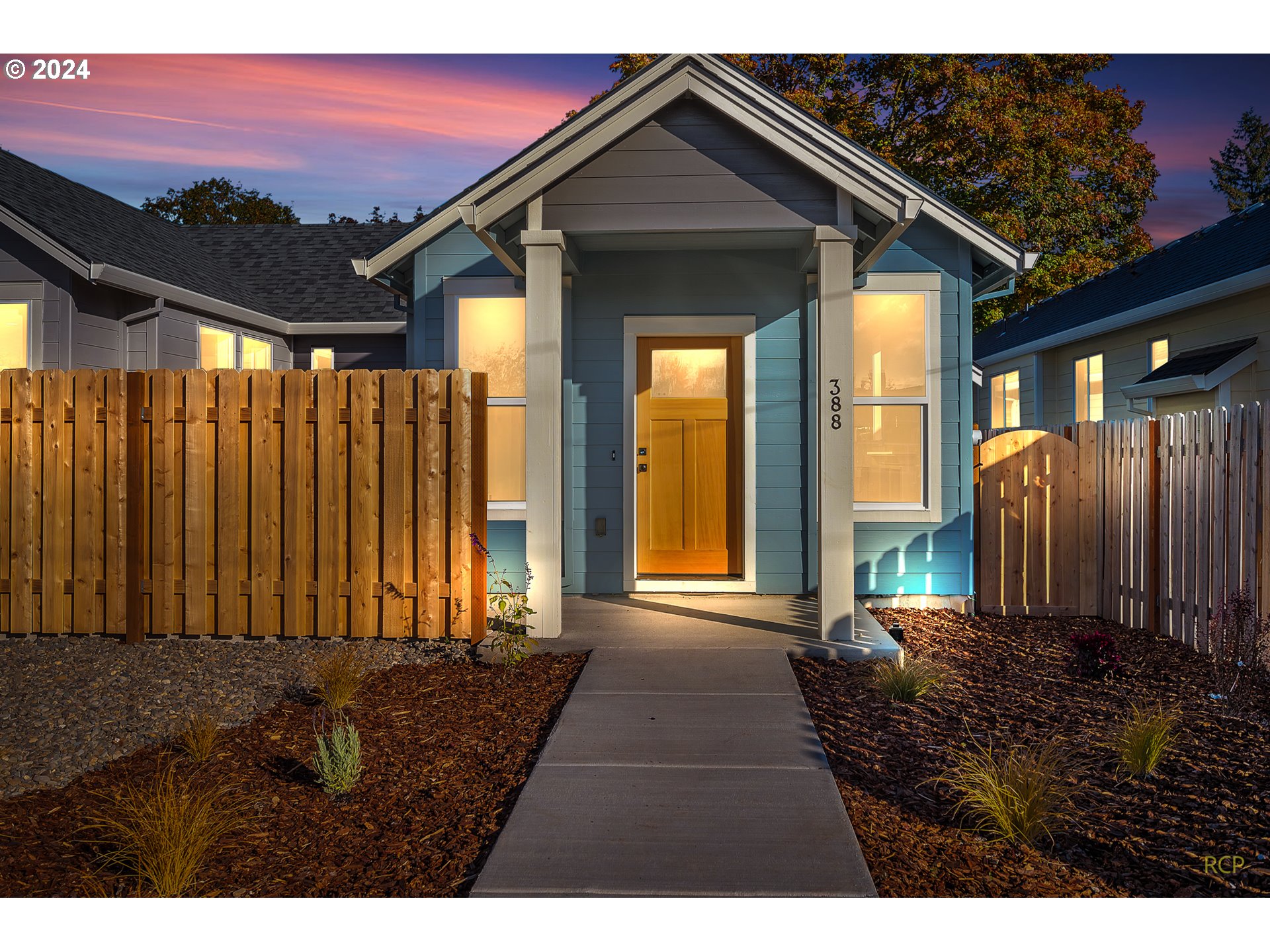 a view of a house with a backyard