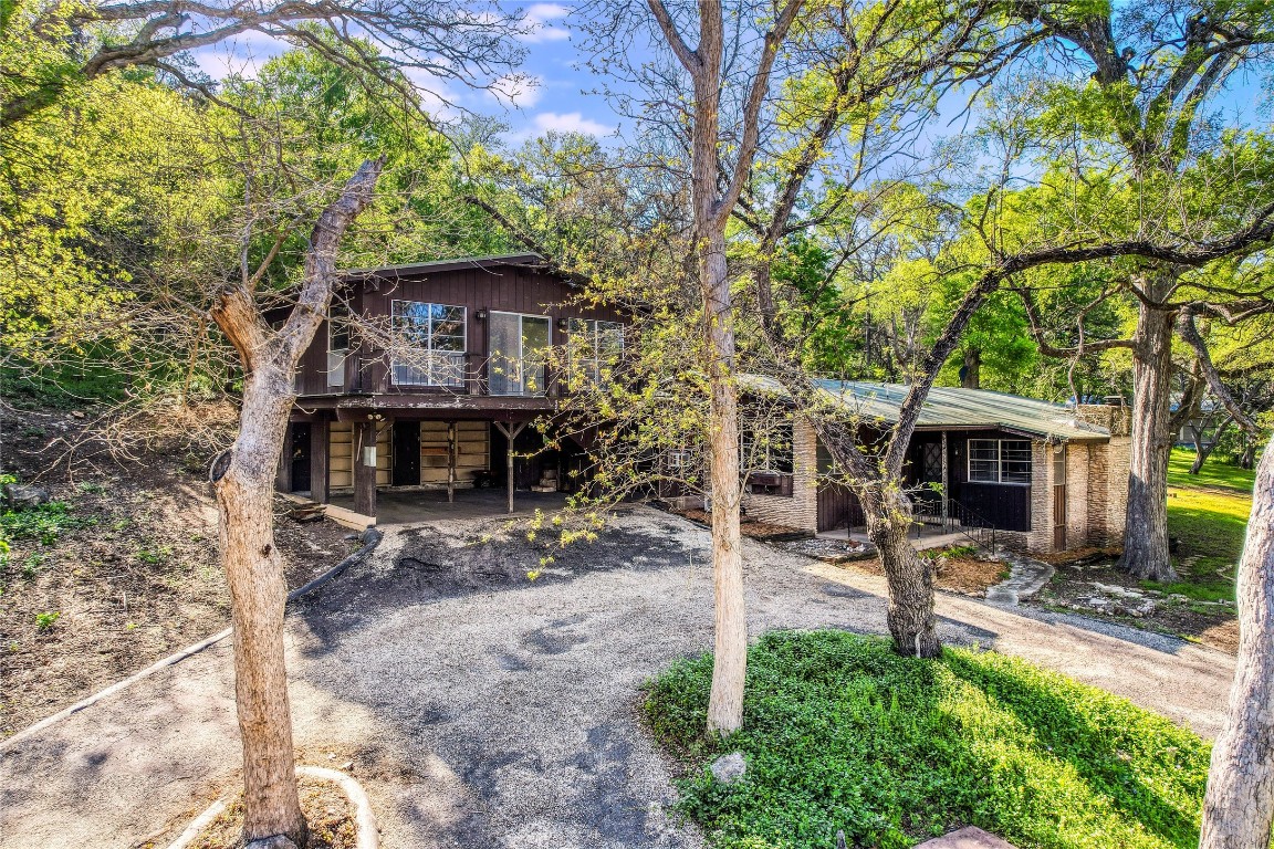 The long driveway from E. Reeds Park Road heads over a bridge allowing you a glimpse of the magic that awaits you.