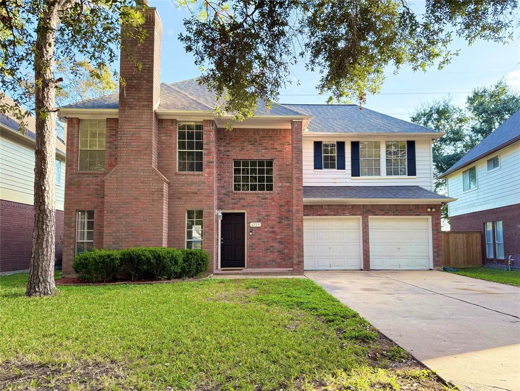 front view of a house and a yard