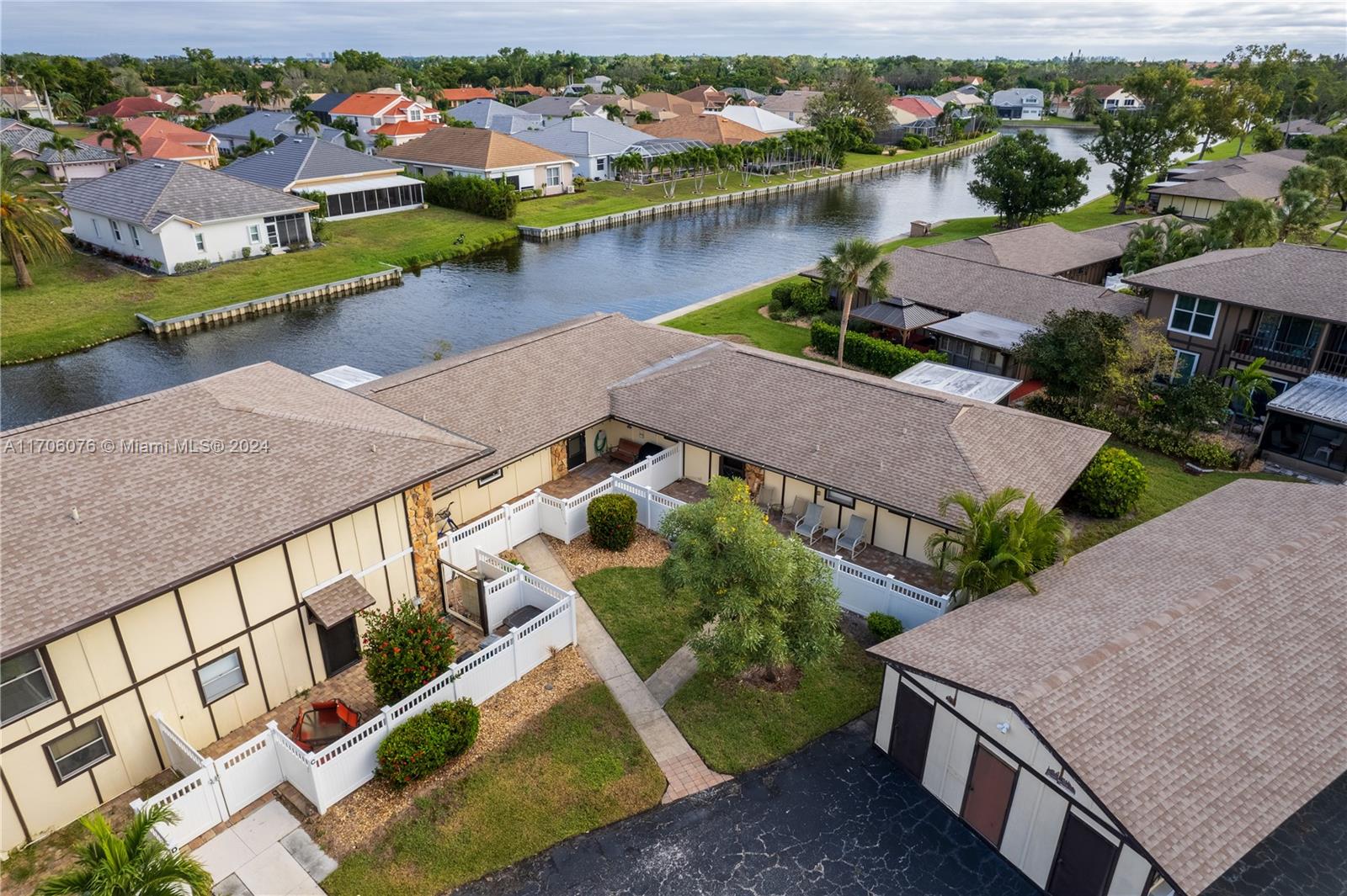 an aerial view of a house with a lake view