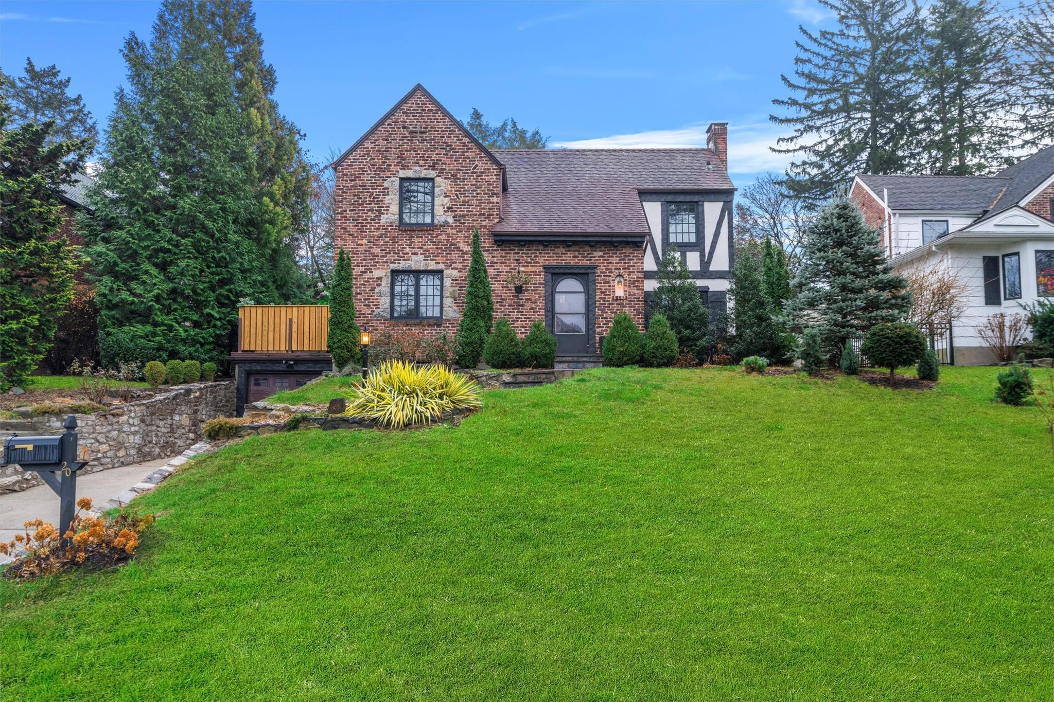 Tudor house with a front yard