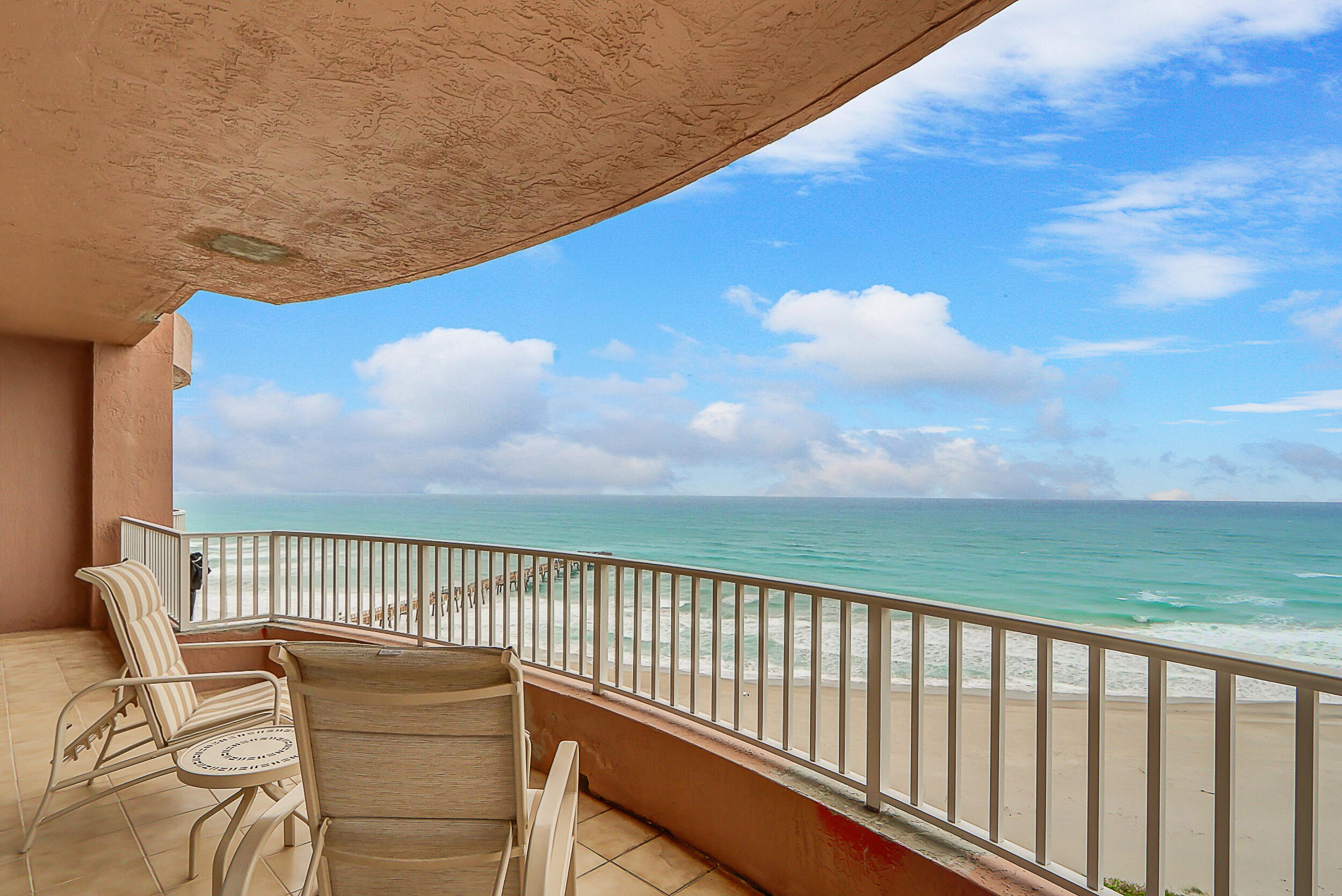 a view of balcony with furniture