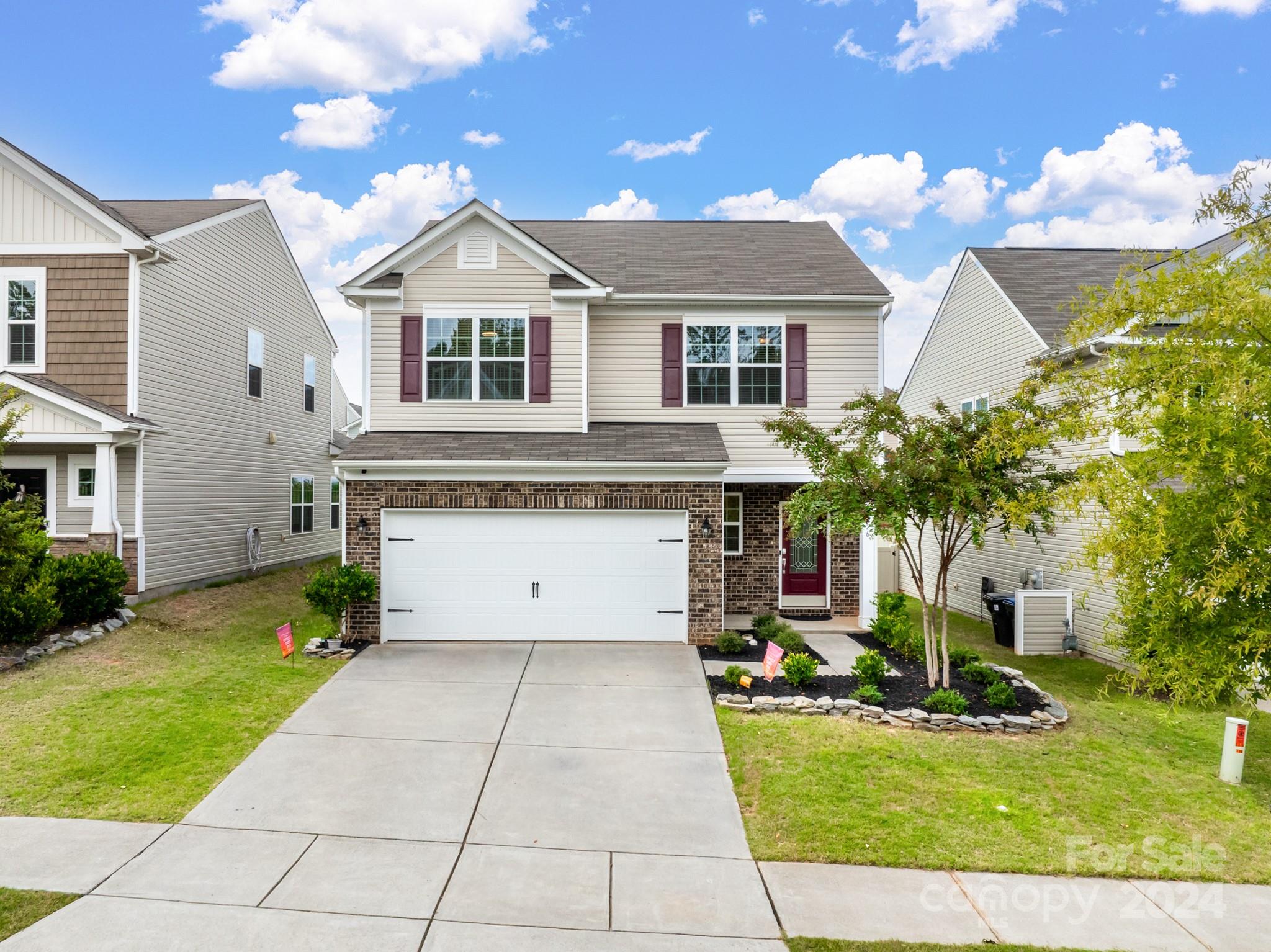 a front view of a house with a yard