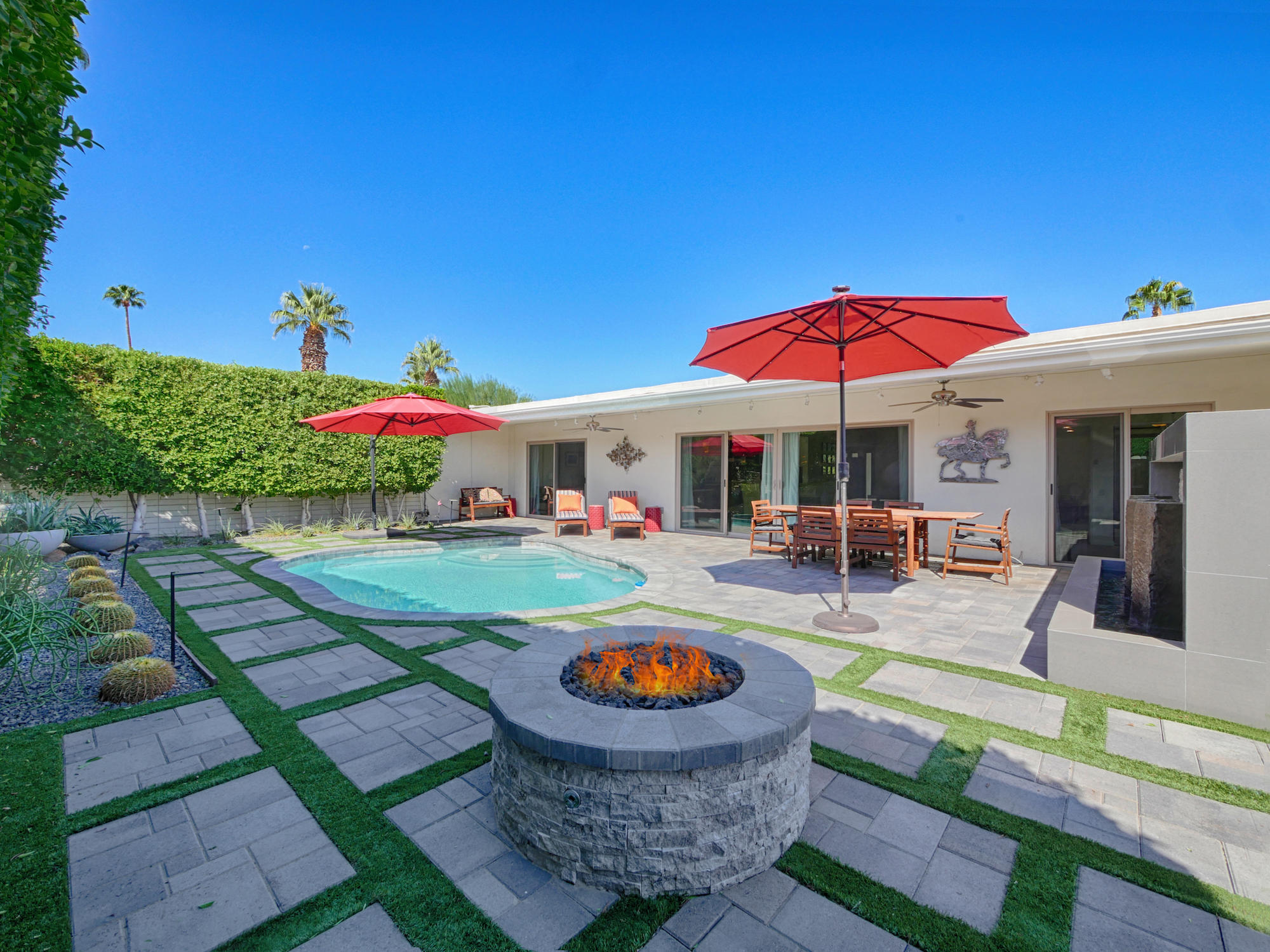 a view of a swimming pool with a patio