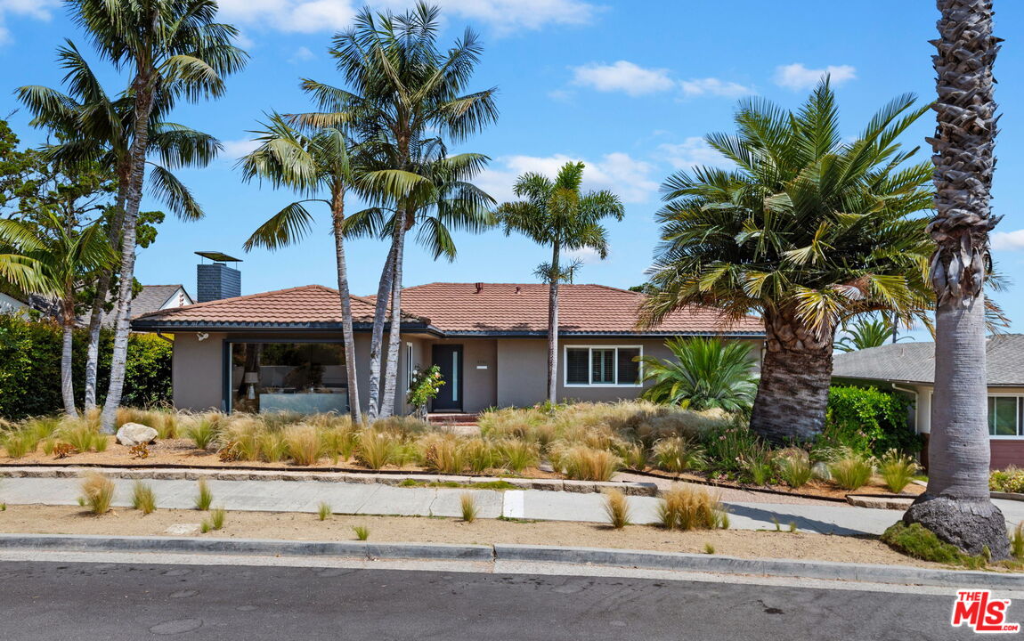 a front view of a house with swimming pool and porch