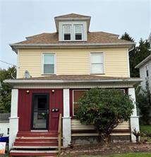 a front view of a house with a porch