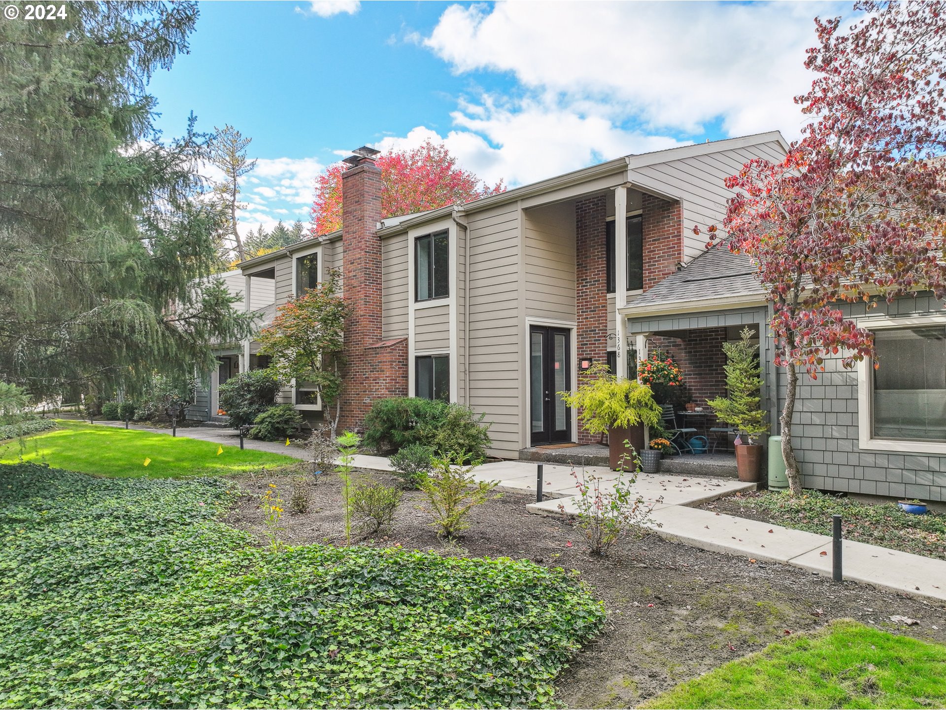 a front view of a house with garden